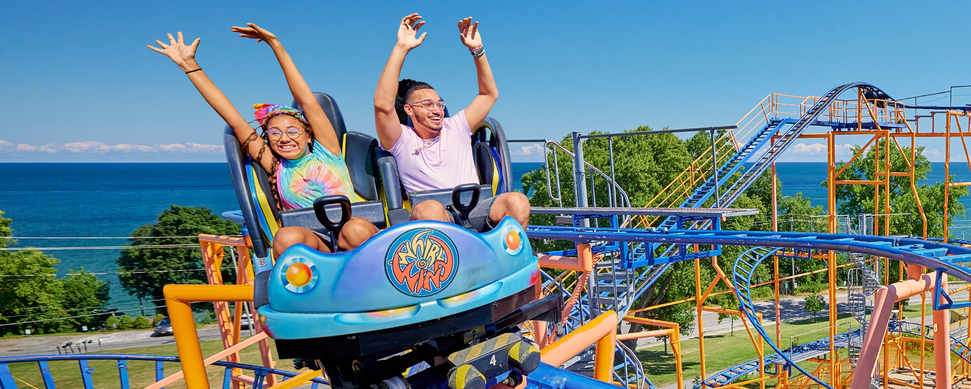 Teens riding on the Whirlwind coaster.