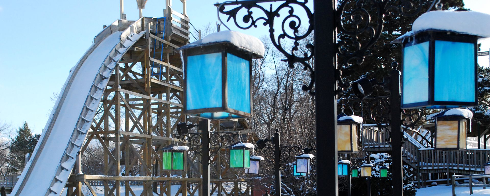 A snowy scene with the Flume hill and Train lanterns.